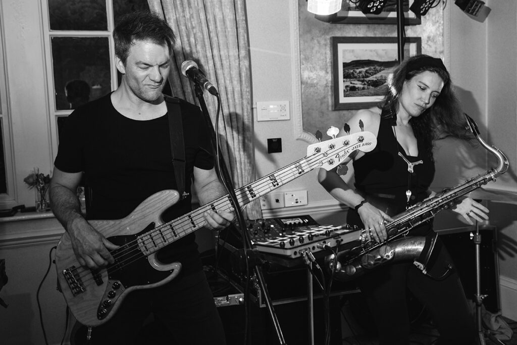 Bass guitarist and sax player performing live at Wood Hall wedding in Wetherby